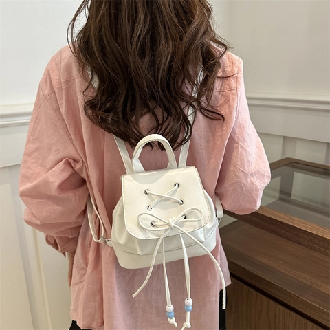 Damen Mini PU-Leder Rucksack Mit Schleifenknoten Kordelzug Design Modische Klappe Kleine Handtasche Casual Urban Schultasche
