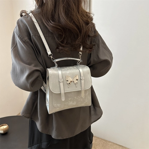 Mini Mochila de Cuero PU para Mujer Moda Elegante Mariposa de Metal Pequeño Bolso de Hombro Cruzado Bolso de Mano Tendencia