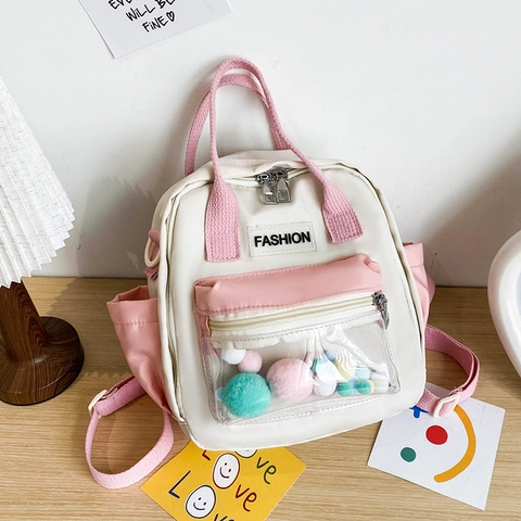 Mochila de Nailon Mini de Estilo Japonés Para Mujeres Estudiantes Bolso de Mano de Bloque de Color Con Bolsillo Transparente de Pompones Literario Fresco Bolso de Hombro de Viaje Diario