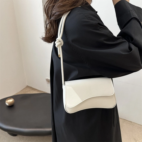Women PU Leather Underarm Bag Minimalist Wave Flap Knotted Shoulder Strap Solid Color Commuting Baguette Shoulder Bag