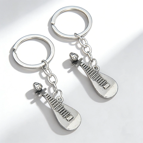 Portachiavi in Lega Vintage a Forma di Pipa Strumento Musicale Argento Strass Apribottiglie Regalo per Amanti della Musica Pendente Borsa