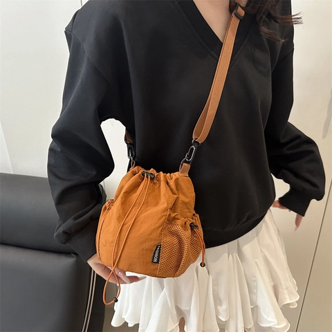 Nylon Drawstring Bucket Bag For Women Lightweight Crossbody Shoulder Bag Simple Casual Cell Phone Bag With Side Mesh Pockets