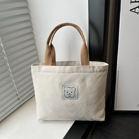 Sac à Main Seau en Toile Minimaliste pour Femme Style Japonais Petit Sac Fourre-tout avec Écusson Ours Dessin Animé
