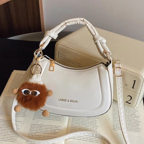 Borsa a Mezzaluna con Manico Annodato in Pelle PU Minimalista per Donna Borsa a Tracolla Pendolare Coreana con Ciondolo Mostro di Peluche