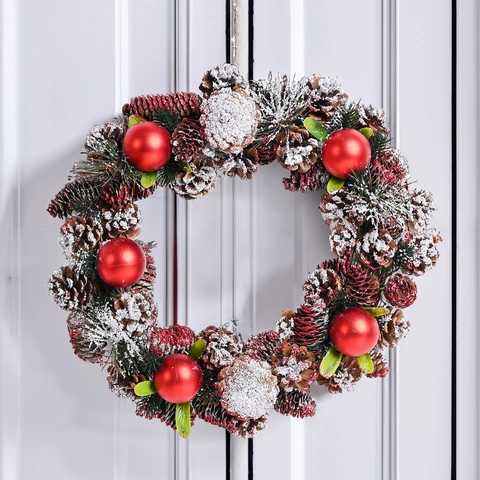 Corona Di Natale Fatta A Mano Con Pigne Palline Rosse E Neve Artificiale Per Decorazione Appesa Alla Porta Di Casa