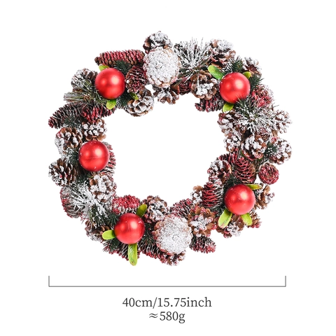 Corona Di Natale Fatta A Mano Con Pigne Palline Rosse E Neve Artificiale Per Decorazione Appesa Alla Porta Di Casa