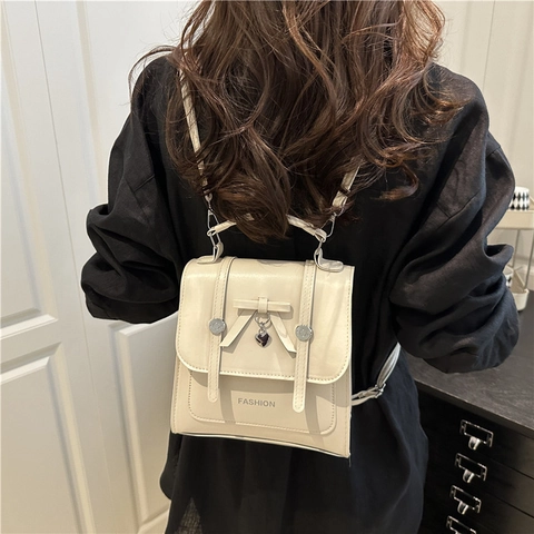 Preppy-Stil PU-Leder Schleife Kleiner Rucksack Für Damen Süßer Herzanhänger Mode Schulter Umhängetasche Student Buch Tasche