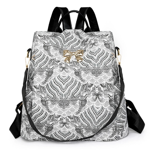 Zaino da Donna con Stampa Retrò Fiocco di Metallo di Moda Grande Capacità in Pelle PU Borsa da Viaggio Motivo a Onde Antifurto