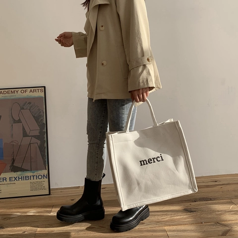 Einfache Urbane Segeltuch Tragetasche Für Damen Merci Buchstabendruck Große Kapazität Lässige Schultertasche Pendler Handtasche