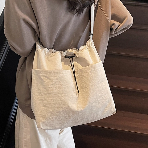 Large Capacity Canvas Drawstring Bucket Bag For Women Japanese Casual Crossbody Shoulder Bag Urban Minimalist Commuter Tote Bag