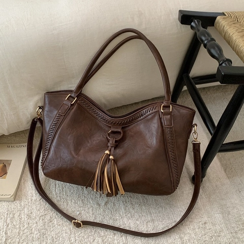 Damen Retro PU Leder Große Kapazität Tragetasche Western Stil Quaste Dekoration Schultertasche Gewebte Nähte Reise Handtasche