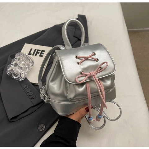 Mode Damen Mini Rucksack PU Leder Glänzende Kordelzug Tasche Mit Schleife Band Und Perlen Vielseitige Tägliche Schultertasche