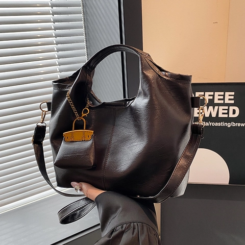 Vintage PU Leather Bucket Bag For Women Fashionable Shoulder Crossbody Bag With Mini Charm Trendy Commuter Handbag