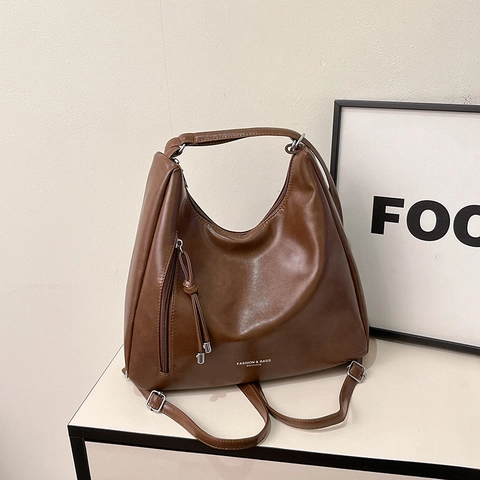 Damen Große Kapazität Vintage PU Leder Tragetasche Mode Pendeln Schulter Umhängetasche Retro Mehrzweck Rucksack Quaste