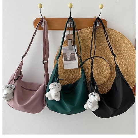 Women Minimalist Canvas Crescent Crossbody Bag Adjustable Shoulder Strap Hobo Bag With Plush Tiger Charm Casual Travel Bag