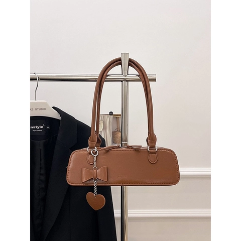 Bolso de Axila de Cuero PU Vintage para Mujer Moda Lazo Colgante de Corazón Bolso de Hombro Baguette Color Sólido Casual