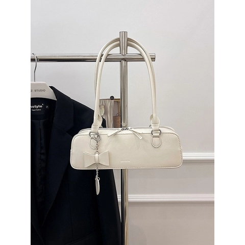 Bolso de Axila de Cuero PU Vintage para Mujer Moda Lazo Colgante de Corazón Bolso de Hombro Baguette Color Sólido Casual