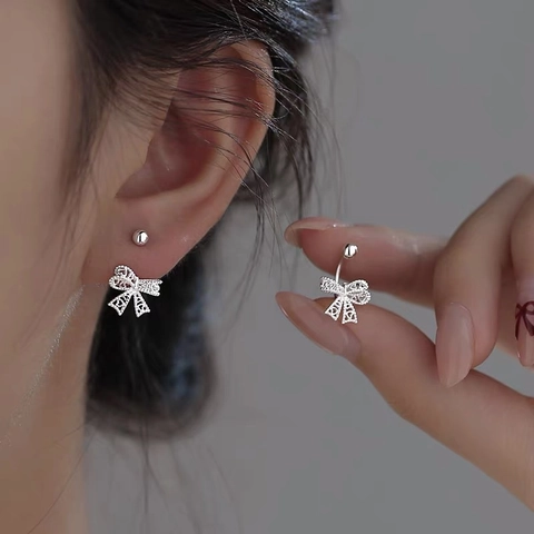 S999 Fijn Zilveren Holle Strik Oorknopjes Voor Dames Lichte Luxe Schroefsluiting Minimalistische Zilveren Strik Oorbellen
