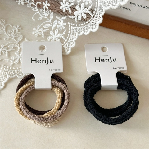Einfache Hoch Elastische Nahtlose Polyester Haargummis Für Damen Granulat Samt Texturierte Haarbänder Ponytail Halter