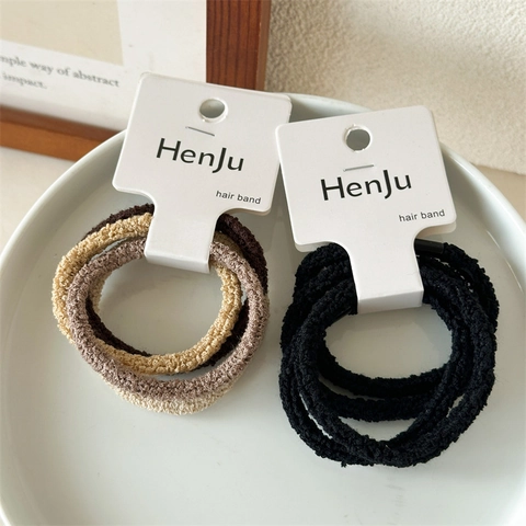 Einfache Hoch Elastische Nahtlose Polyester Haargummis Für Damen Granulat Samt Texturierte Haarbänder Ponytail Halter