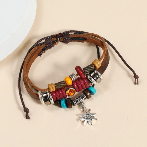 Bracciale Vintage Bohemienne Multistrato in Pelle di Vacchetta Con Ciondolo Malocchio Sole in Lega Perline Legno Gioielli Etnici