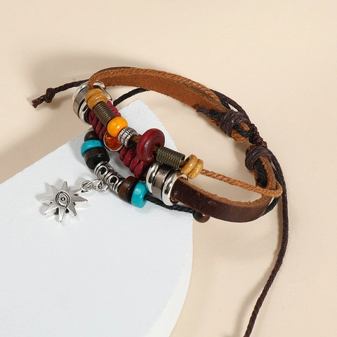 Bracciale Vintage Bohemienne Multistrato in Pelle di Vacchetta Con Ciondolo Malocchio Sole in Lega Perline Legno Gioielli Etnici