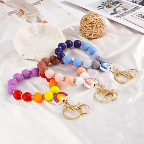 Porte-clés Bracelet en Perles de Silicone pour Femmes Breloque Arc-en-ciel Colorée Avec Fermoir en Métal Doré Accessoires