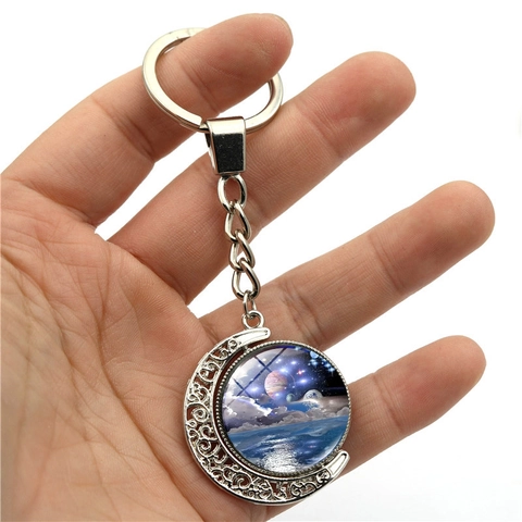 Portachiavi a Luna Rotante Galassia Cielo Stellato Ciondolo a Mezzaluna Cava a Doppia Faccia Portachiavi in Vetro Cabochon per Regalo Borsa