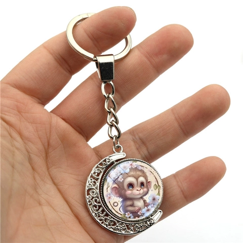 Portachiavi a Forma di Luna Rotante in Lega di Zinco Argento Con Motivo a Scimmia Cartone Animato Design Traforato Pendente per Borsa