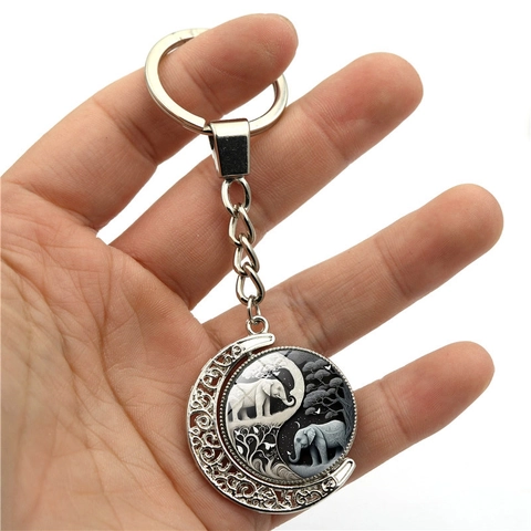 Portachiavi a Luna Rotante in Lega di Zinco Elefante Yin Yang Cabochon in Vetro Retrò Argento Girevole per Donna Regalo