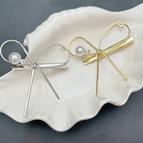 Elegante Fermaglio a Becco d'Anatra in Lega a Forma di Fiocco Con Perla Artificiale e Strass Stile Coreano Oro Argento per Donna