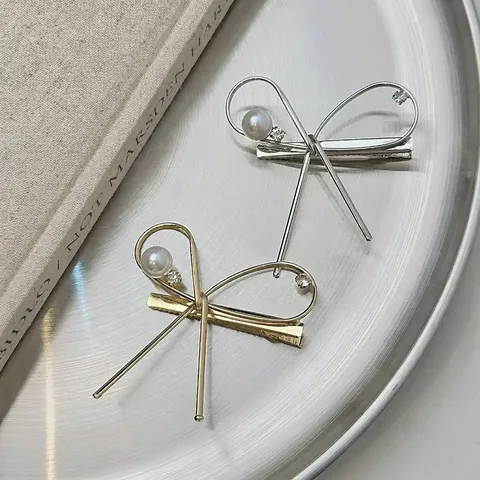 Elegante Fermaglio a Becco d'Anatra in Lega a Forma di Fiocco Con Perla Artificiale e Strass Stile Coreano Oro Argento per Donna