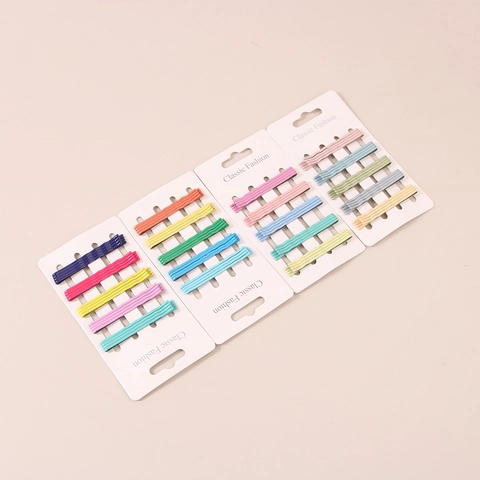 Fermagli per capelli in metallo stile coreano in colori caramella. Pinze a onda in toni macaron con finitura laccata.