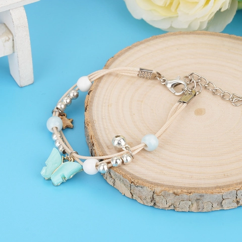 Süßes Handgefertigtes Gewebtes Armband Mit Hellblauen Schmetterlingsanhängern Stern Glocken Perlen Verstellbares Wachskordel Armband Für Damen Schmuck