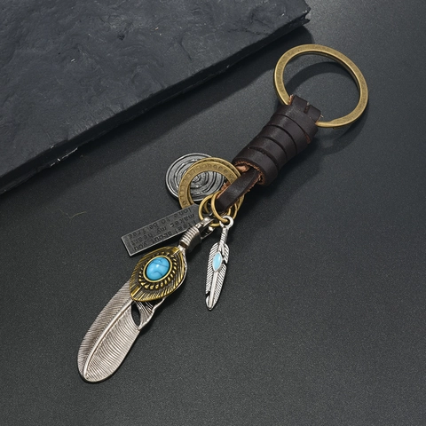 Portachiavi in Pelle di Vacchetta Vintage Ciondolo a Piuma in Lega Con Turchese Artificiale Anello Intrecciato Bohemian