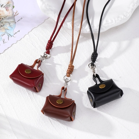 Vintage PU-Leder Mini Tasche Halskette für Damen Kleine Mode Kopfhörertasche Münzbörse Dekorative Kordel Hals Accessoire