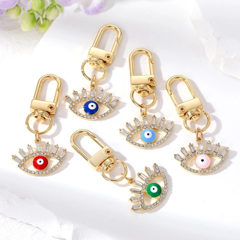Luxus Legierung Strass Böser Blick Schlüsselanhänger Boho Ethno Hohl Auge Tasche Charme Vergoldet Wimpern Anhänger Schmuck