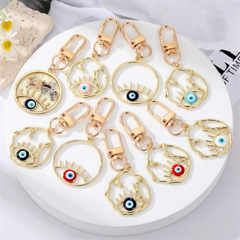 Llavero de Aleación Hueco Ojo Turco Colgante Geométrico Redondo Pestañas Azul Nazar Ojo Amuleto para Bolso Accesorio de Joyería
