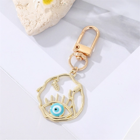 Llavero de Aleación Hueco Ojo Turco Colgante Geométrico Redondo Pestañas Azul Nazar Ojo Amuleto para Bolso Accesorio de Joyería