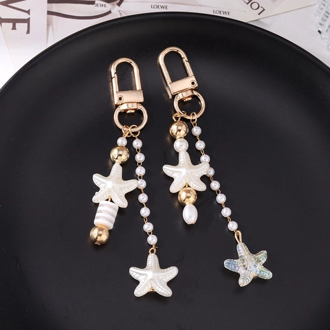 Ozean Stil Seestern Künstliche Perle Schlüsselanhänger Für Damen Süße Zinklegierung Perlenbesetzt Seestern Tasche Anhänger Gold Herz Rund Schlüsselring Geschenk