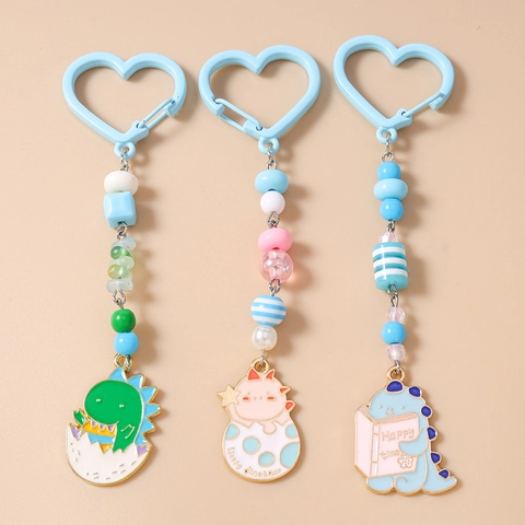 Portachiavi con Perline Dinosauro Cartone Animato Gancio a Cuore Perline in Resina Macaron Lega Smalto Ciondolo Dinosauro Fascino Borsa Regalo Donna Bambini