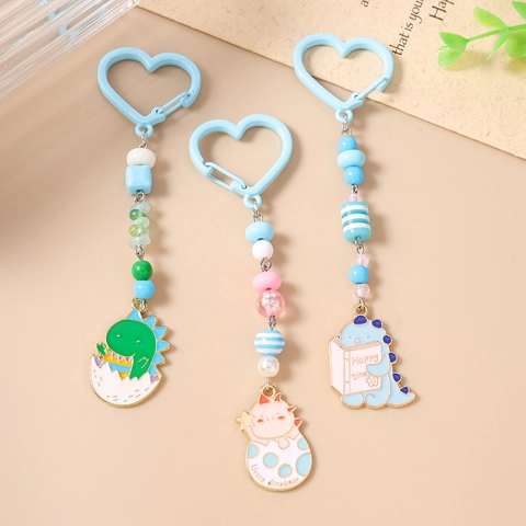 Portachiavi con Perline Dinosauro Cartone Animato Gancio a Cuore Perline in Resina Macaron Lega Smalto Ciondolo Dinosauro Fascino Borsa Regalo Donna Bambini