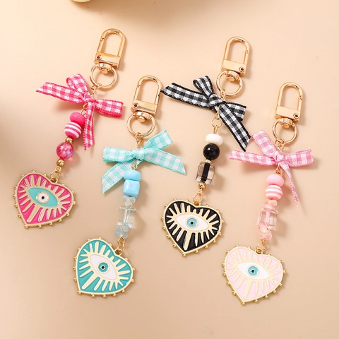 Porte-clés Perlé Cœur Mauvais Œil pour Femmes Nœud Ruban Plaid Pendentif de Sac Alliage de Zinc Émail Accessoire de Clé Cadeau