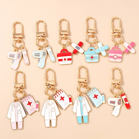 Portachiavi in Smalto a Tema Medico Uniforme da Medico Infermiere Termometro Cerotto Kit di Pronto Soccorso Anello Portachiavi in Metallo Gioiello Regalo