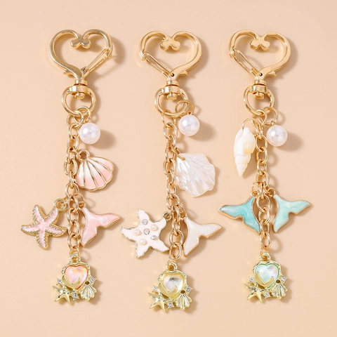 Portachiavi a Tema Oceano con Stella Marina Conchiglia Coda di Pesce Perla Artificial Lega di Zinco Oro Forma di Cuore per Donna Pendente Borsa Regalo