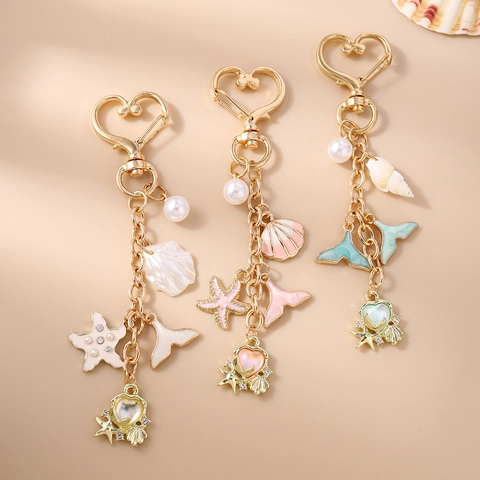 Portachiavi a Tema Oceano con Stella Marina Conchiglia Coda di Pesce Perla Artificial Lega di Zinco Oro Forma di Cuore per Donna Pendente Borsa Regalo