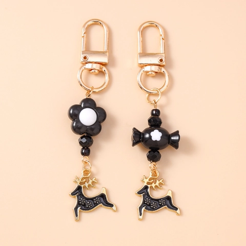 Weihnachten Rentier Schlüsselanhänger Kreative Schwarze Blume Süßigkeiten Anhänger Gold Zinklegierung Emaille Elch Anhänger Tasche Deko Schmuck Geschenk