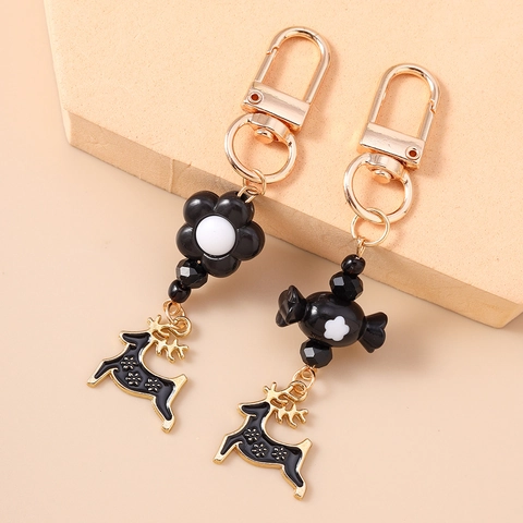 Weihnachten Rentier Schlüsselanhänger Kreative Schwarze Blume Süßigkeiten Anhänger Gold Zinklegierung Emaille Elch Anhänger Tasche Deko Schmuck Geschenk
