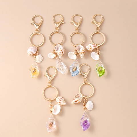 Portachiavi Conchiglia Oceano Anello in Lega Dorata Ciondolo in Resina di Lumaca di Mare Naturale Accessorio Luminoso Borsa