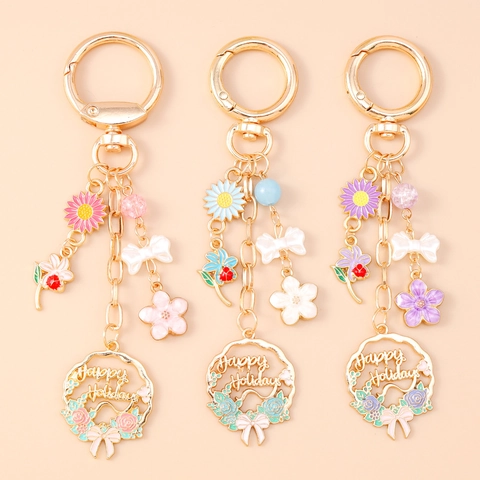 Llavero de Guirnalda de Flores y Lazo con Letras Happy Holidays Colgante de Bolso de Aleación de Zinc Regalo para Mujer